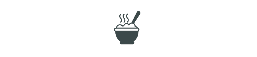 A steaming bowl of soup with a spoon.
